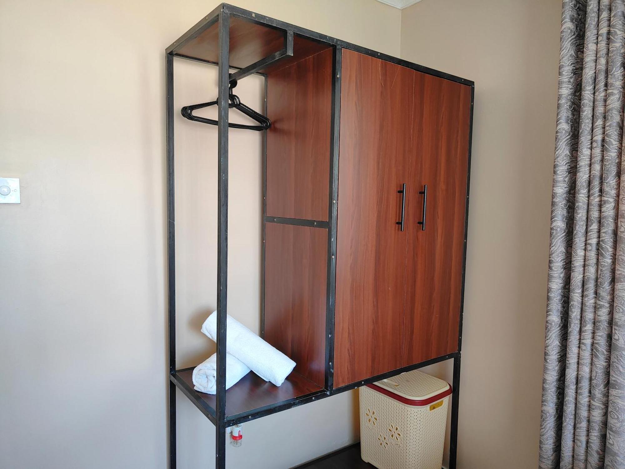 Ferienwohnung MILIMANI DRIVE LIVING I LUXE FLAWLESSLY FURNISHED UNITs Kisumu Zimmer foto